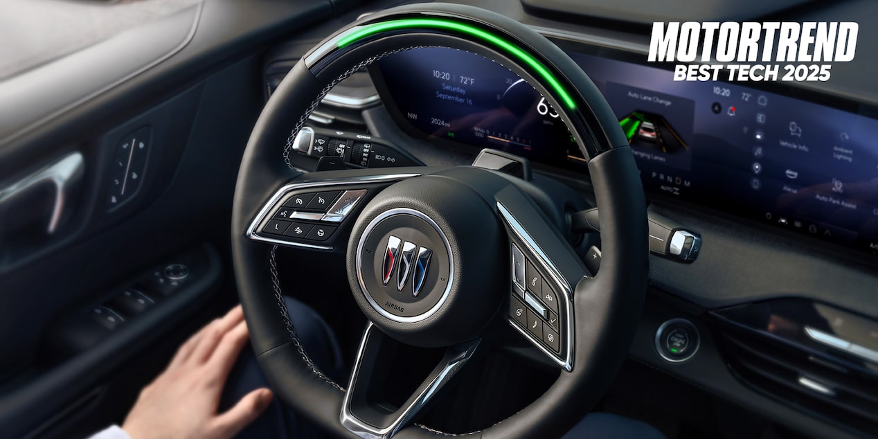 Driver Using the Super Cruise Feature in a 2025 Buick Enclave SUV with Motor Trend Award Logo