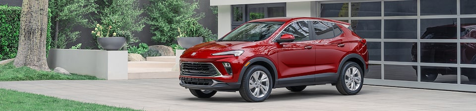 Red Buick SUV Parked in Driveway Facing Away from the Garage