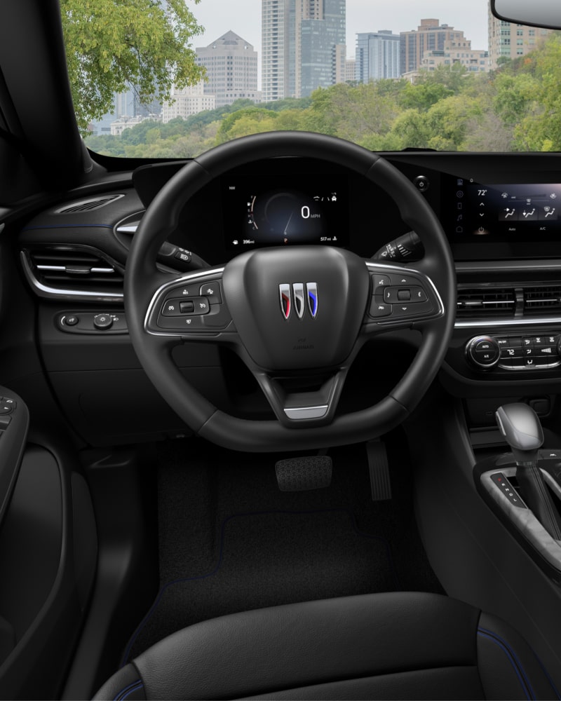 Close-up of the Buick Envista ST Interior Drivers Side View of the Steering Wheel and Dashboard