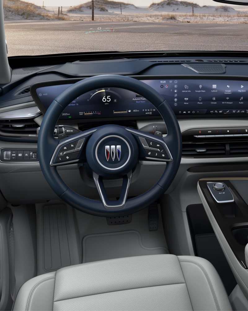 Close-up of the Buick Enclave Avenir Interior Drivers Side View of the Steering Wheel and Dashboard