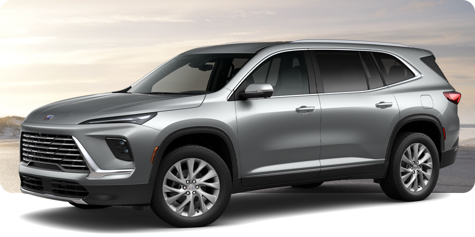 Front-Three Quarter View of a Silver Buick Enclave Mid-Size SUV Parked Near a Beach